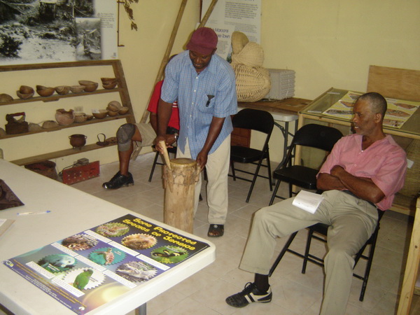 Colonel Sterling of the Moore Town Maroons explains a feature of this drum